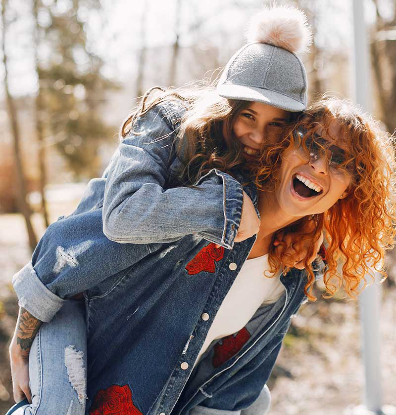 Elegant mother with daughter in a summer park